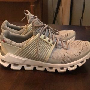 Grey and white on cloud running shoes.